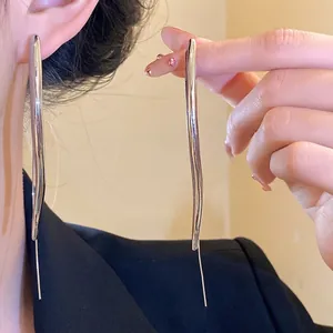 Elegant silver long wavy water drop earrings for a minimalist and modern look