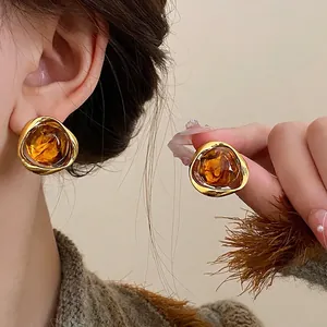 Vintage amber brown oval geometric stud earrings with gold metal frame Maillard style