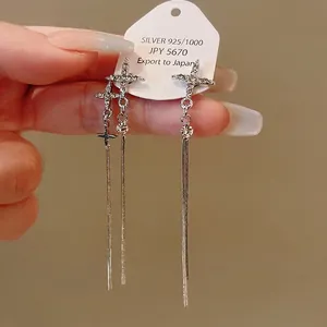 Elegant silver-tone long tassel earrings with sparkling crystal cross studs