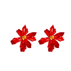 Exaggerated vibrant red flower stud earrings with yellow center, bohemian resort style