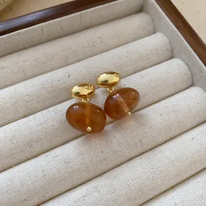 Vintage Maillard style brown translucent oval drop earrings with golden metallic studs