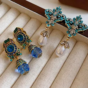 Vintage luxury blue crystal and pearl drop earrings with sparkling rhinestone details