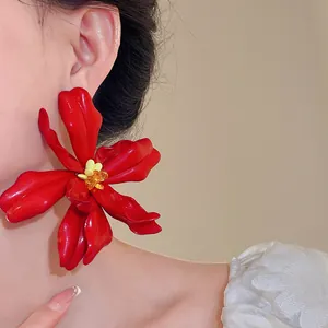 Exaggerated large red acrylic flower stud earrings with yellow bead centers for women