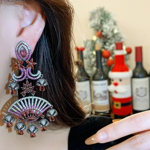 Macro detail of luxurious fan-shaped palace style earrings with pink and white zircons
