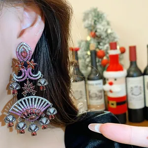 Detailed shot of ornate zircon fan earrings with vintage court style details