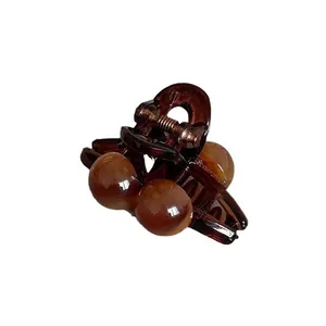 Minimalist coffee brown mini hair claw clip with elegant round bead design for women