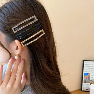 Elegant close-up shot of sparkling rhinestone rectangular hair clips worn by an Asian model