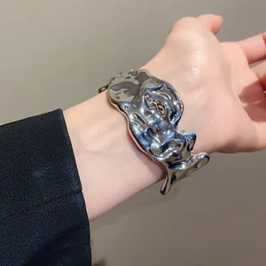Silver wrinkled molten metal open bangle featuring irregular liquid texture design