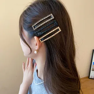 Elegant close-up view of three shimmering square rhinestone hair clips worn as side pins