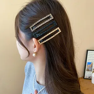 Elegant square rhinestone hair clips in silver and black colors shown on side of hair