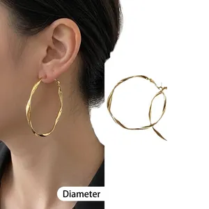 Elegant gold-plated Mobius twist large hoop earrings for women, featuring a stylish design.