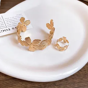 Elegant gold textured floral open cuff bracelet and matching ring set for women