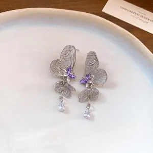 Elegant silver butterfly drop earrings with purple rhinestones and pear-cut charms