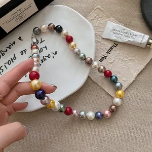 Detailed macro view of a colorful dopamine round pearl beaded necklace