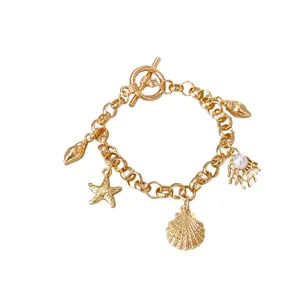 Bracelet à breloques dorées avec étoile de mer, conque et perle, style océan pour femmes