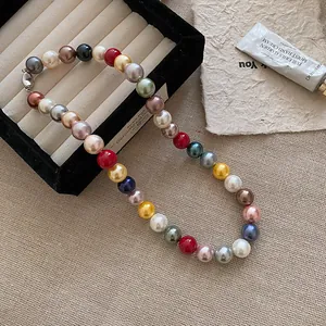 Detailed macro view of vibrant multi-colored round pearl beads on a necklace