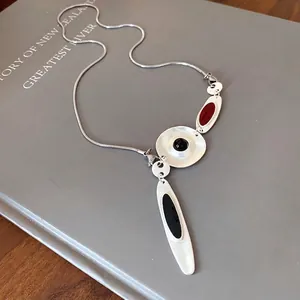 Chic asymmetrical silver-toned metal necklace with colorful enamel pendants and snake chain
