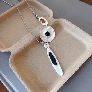 Minimalist irregular metal pendant necklace with black and red drip oil accents