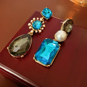 Vintage asymmetric drop earrings with blue crystals and pearls in gold setting