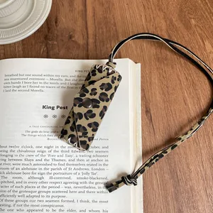 Vintage leopard print leather mini pouch necklace accessory with Maillard style detail