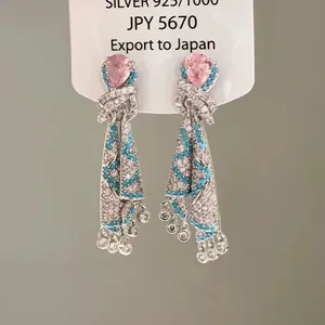 Ethnic style silver earrings with pink teardrop stone and blue pavé crystals