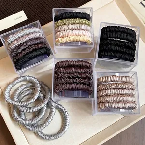 Minimalist 5-piece set of satin-like elastic hair ties in neutral colors with storage box