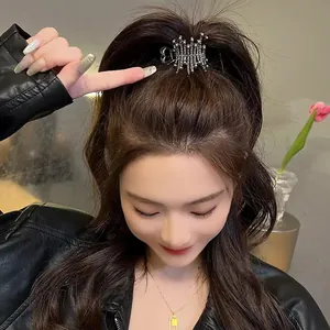 Silver heart rhinestone hair claw clip for high ponytail styling on brunette model