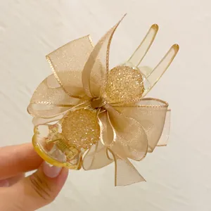Elegant champagne mesh bow hair claw clip decorated with sparkling crystal balls detail