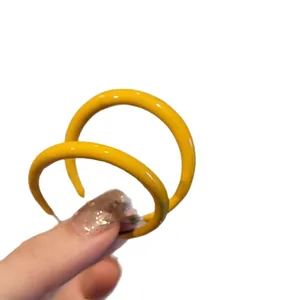 Vibrant yellow geometric hoop earrings for women, minimalist and elegant fashion accessory
