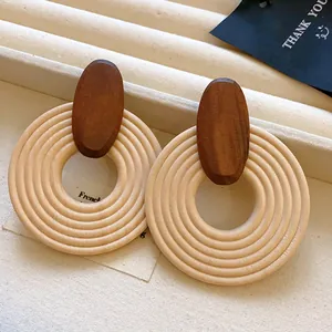 Detailed close-up showing the natural wood grain of bohemian vintage spiral earrings