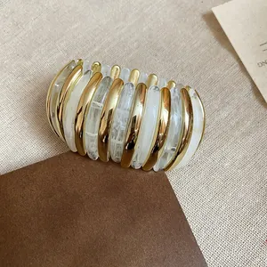Elegant gold and white marbled elliptical stretch bracelet for women's fashion jewelry