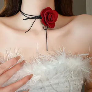 Close-up detail of a romantic red fabric rose choker with black leather cord ties