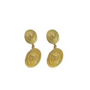 Vintage gold round lion head embossed drop earrings with textured edges