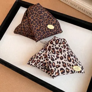 Elegant vintage leopard print triangular hair clips crafted in premium brown and beige fabric
