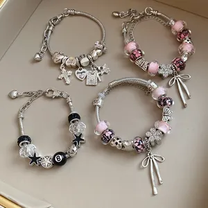 Set of sweet beaded bracelets featuring glass beads and sparkling floral bow charms