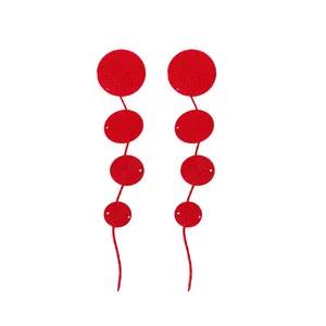 Fashionable red circular textured long tassel drop earrings for women statement style