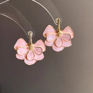 Elegant pink floral earrings with gingko leaf design and silver needles for women
