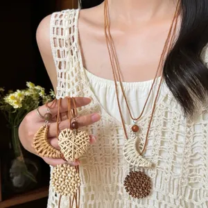 Hand-woven bohemian style heart and moon pendant necklaces shown on female model