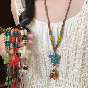 Bohemian ethnic style woven necklace featuring colorful ceramic star pendant for women