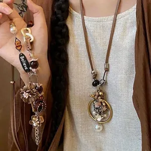 Bohemian ethnic style woven flower necklace with elegant pearl charms for women