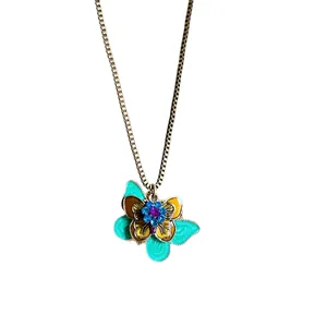 Bohemian style necklace featuring a colorful enamel butterfly pendant on a gold chain