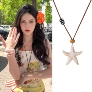Detail showing bohemian starfish necklace with wooden beads and brown woven cord