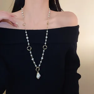 Elegant long sweater chain featuring irregular faux pearls and a large baroque pearl pendant