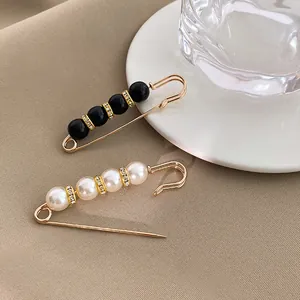 Elegant safety pin brooches with white pearls and black beads for coats and suits