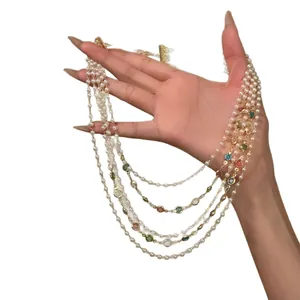 Elegant multi-layered French vintage pearl necklace with colorful gemstone accents