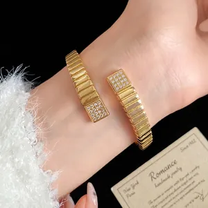 18k gold plated geometric bangle with sparkling zircon stones on a female wrist