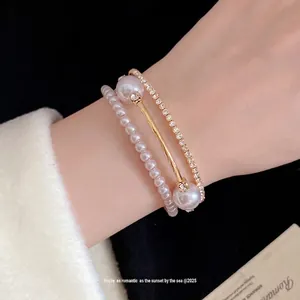 Elegant three-layer vintage style bracelet featuring lustrous pearls and sparkling rhinestones