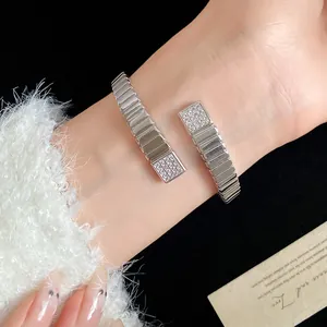 Detailed macro view of 18k gold plated geometric cuff bracelet with sparkling zircon