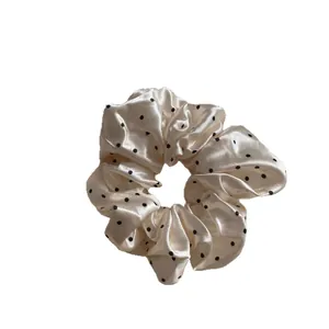 Elegant cream satin large scrunchie with classic black polka dots hair accessory