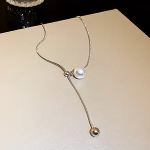 Close-up of elegant adjustable Y-shaped snake chain necklace featuring a pearl and silver bead